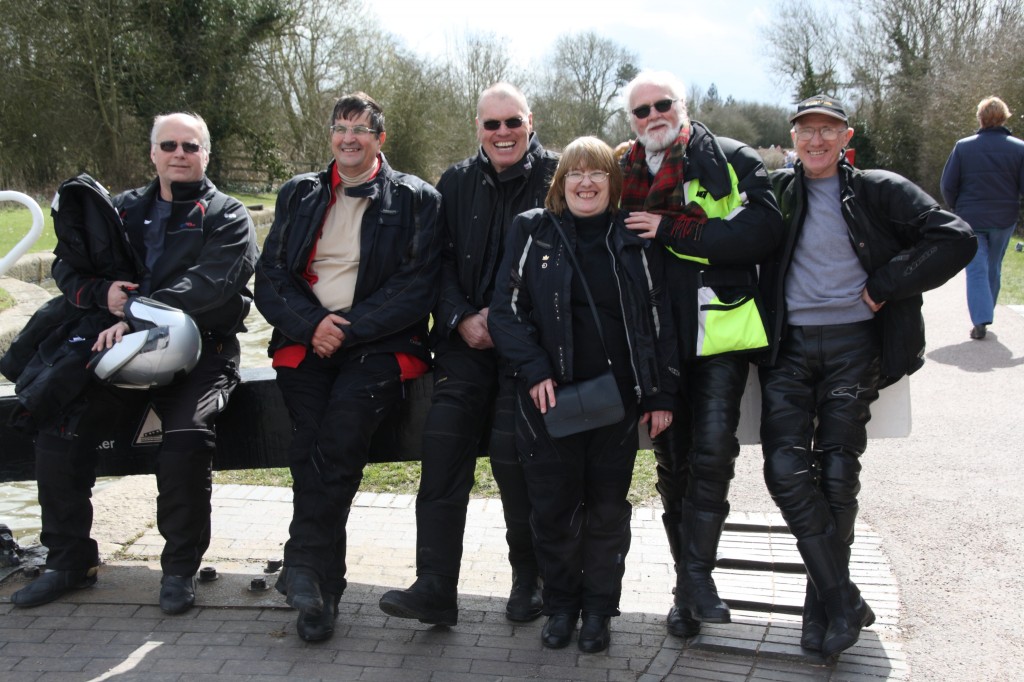 A group of happy members at the top lock