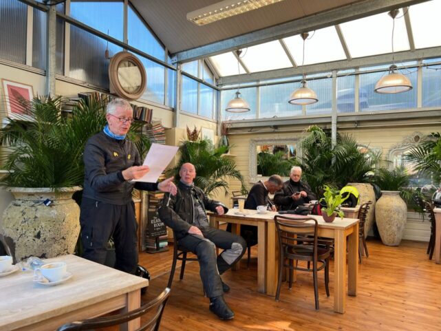 A ride briefing in the glasshouse area at the Burford Cafe